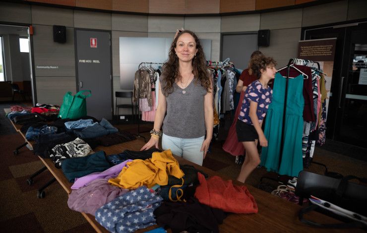 Person standing in front of a clothing stall