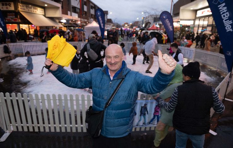 Councillor Sean O'Reilly in front of a snow play area at Springvale Snow Fest