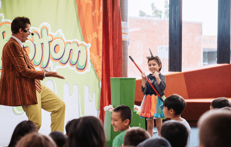 Mr Snotbottom and a child at Dandenong Library