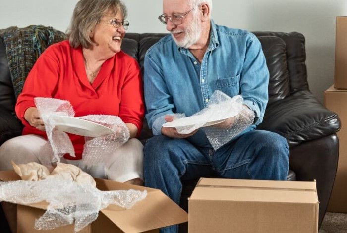 Man and woman packing boxes