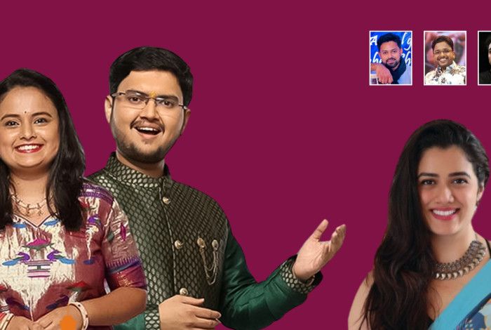 A man and a woman in traditional Indian attire, against a maroon background