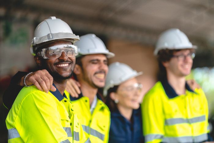 construction workers on a work site in high vis