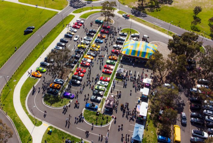 a birds eye view of a car show and shine