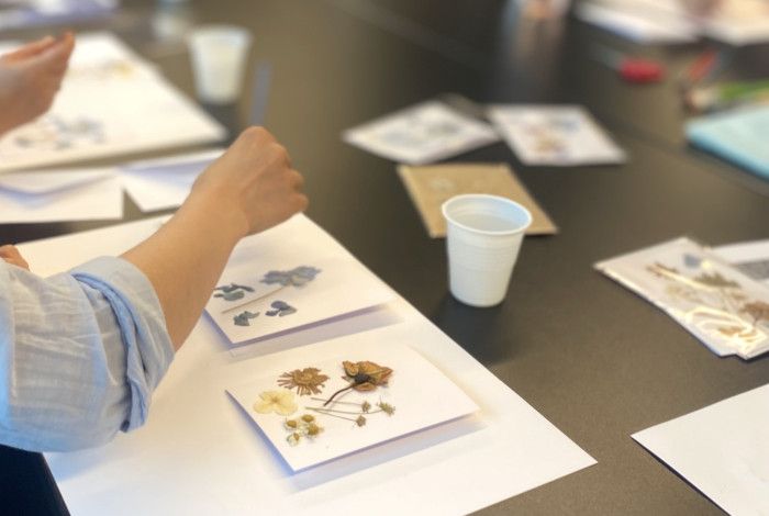 people making pressed flowers 