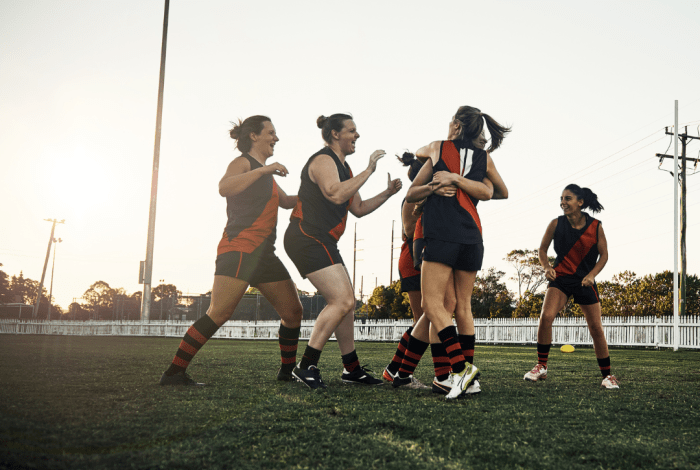 Female football players celebrating