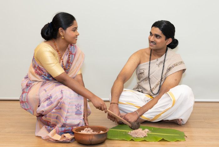 two people sitting on the floor