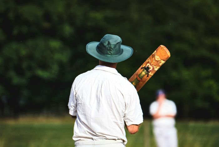 person holding cricket bat