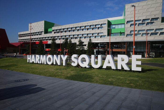 Dandenong Civic Centre with the white letters Harmony Square on the grass.