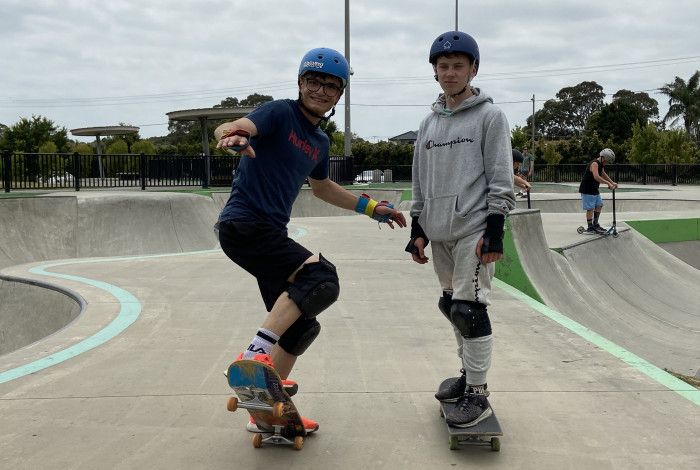 Two young people on skateboards