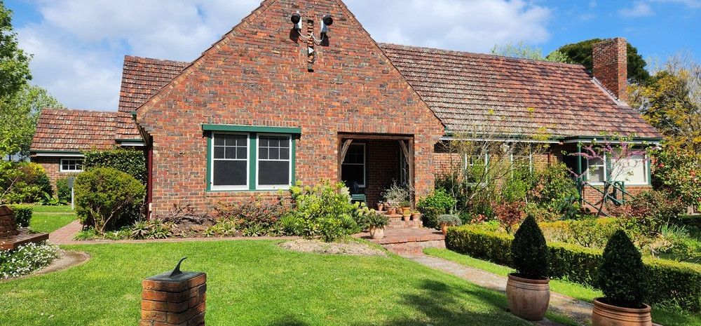 A coloured image of 1936 Benga house at Heritage Hill Museum and Historic Gardens