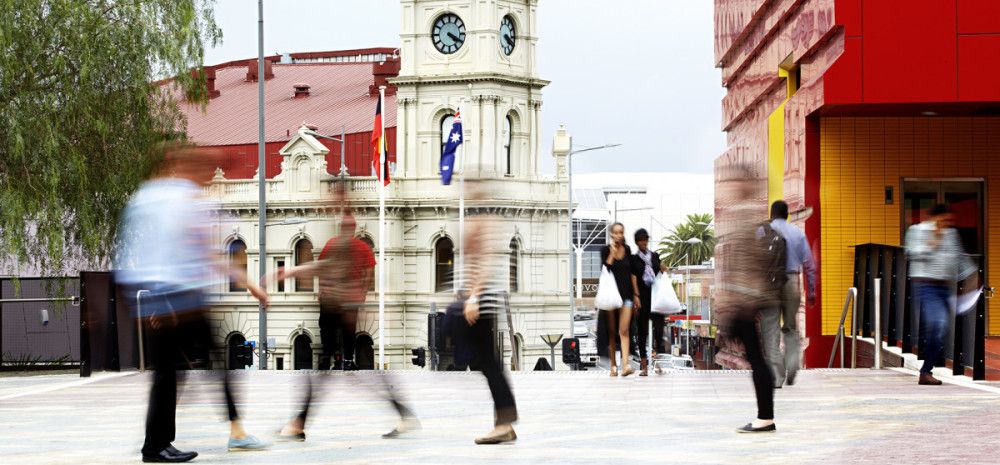 Blurred photograph of people in Harmony Square.