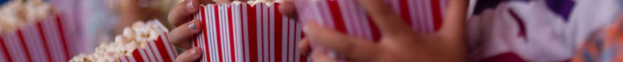 children eating popcorn at the movies