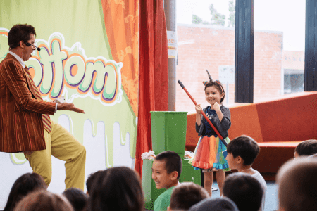 Mr Snotbottom and a child at Dandenong Library