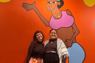 Being Biracial Podcast hosts in front of Olana's mural