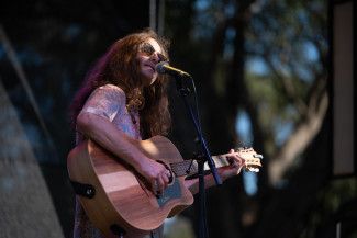 A performer singing on stage