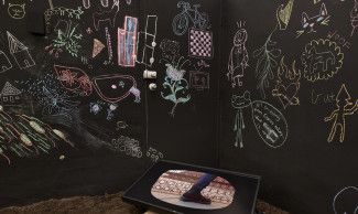 Chalk drawings on a black wall