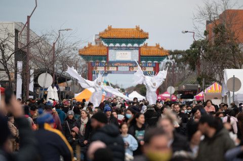 People enjoying a street festival.