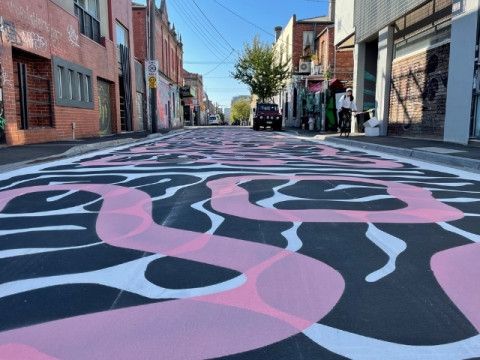 Coloured mural on the road.