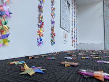 Paper stars hanging on the wall and on the floor