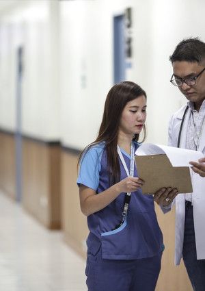 Doctor and nurse looking at paperwork