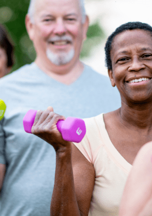 Older people using hand weights.