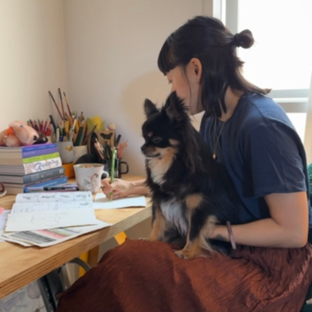 Kim Lam in her studio with her dog